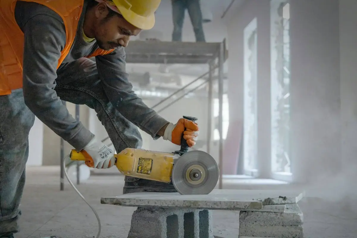 Worker cutting stone on a renovation site